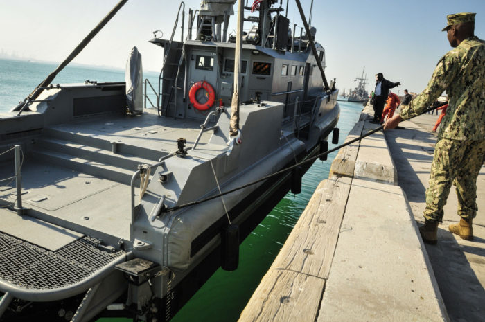 U.S. Navy’s Coastal Command Boat lowered into water in its homeport of Bahrain, 2014. (Mass Communication Specialist 1st Class Felicito Rustique)