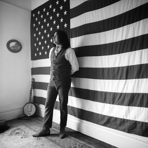 'Jerry and the American flag,' Garcia during a session for the 'Old and in the Way' bluegrass album. B&WDeadJerryFlag_lg