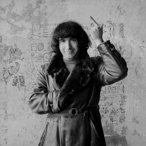 'Jerry at the Wall,' Garcia posing in Greene's apartment in front of a wall inscribed with Egyptian hieroglyphics. B&WDeadJerryWall_lg