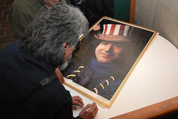 Greene signs the "Captain Trips" Garcia poster. <p>Herb Greene signing the "Captain Trips" Garcia poster. Photo by Ken Best.</p>