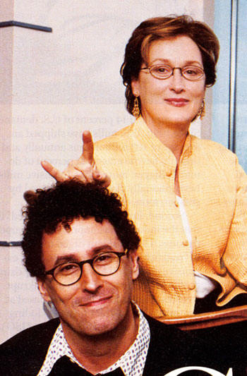 Actress Meryl Streep gives the sign of the Devil just over the head of �Angels in America� director, Mike Nichols.