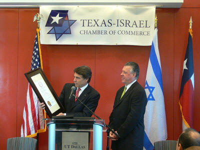 Governor Perry receives an award from the Texas-Israel Chamber of Commerce, a private Zionist business organization Perry established in September 2007. A glance at the board members of Perry's group of Israeli supporters reveals the heads of two of Mossad's biggest intelligence gathering companies in the United States: Amdocs and Elbit. Elbit (a military subsidiary of Elron) is directly involved in stealing presidential elections in the United States through its control of the tally of the Iowa caucus.
